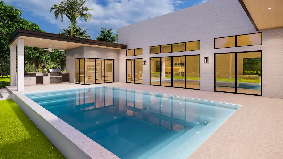 Piscine moderne avec eau cristalline devant une maison contemporaine